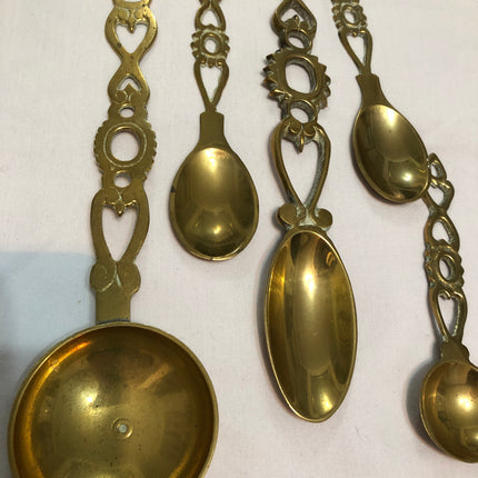 Collection of Eight Welsh Brass Love Spoons.