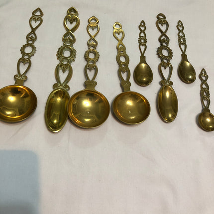 Collection of Eight Welsh Brass Love Spoons.