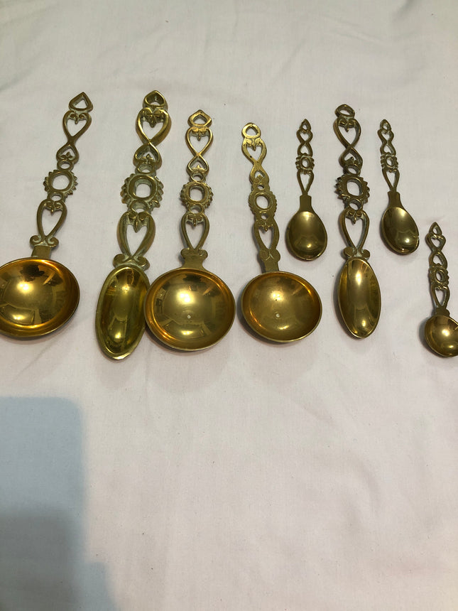 Collection of Eight Welsh Brass Love Spoons.